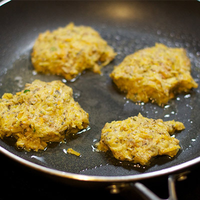 vegetable pakora cooking in pan